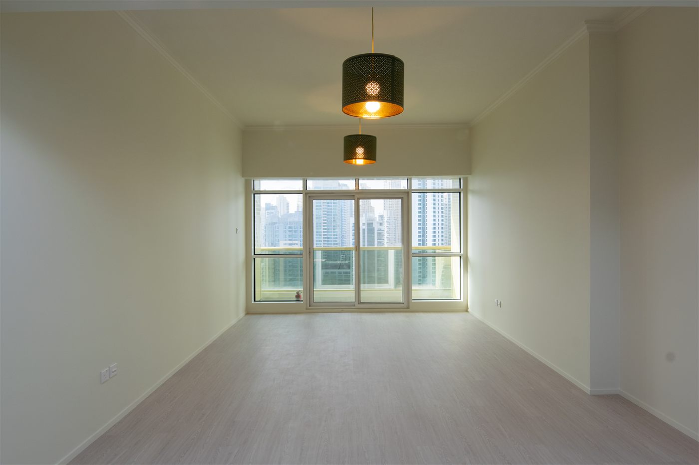 Bright living room with JLT tower views