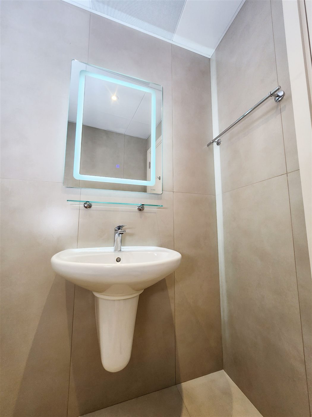 Guest WC with backlit mirror