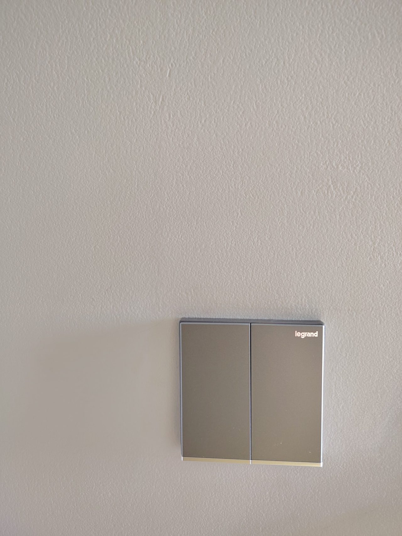 Installed Legrand double-gang light switch in the guest bedroom.
