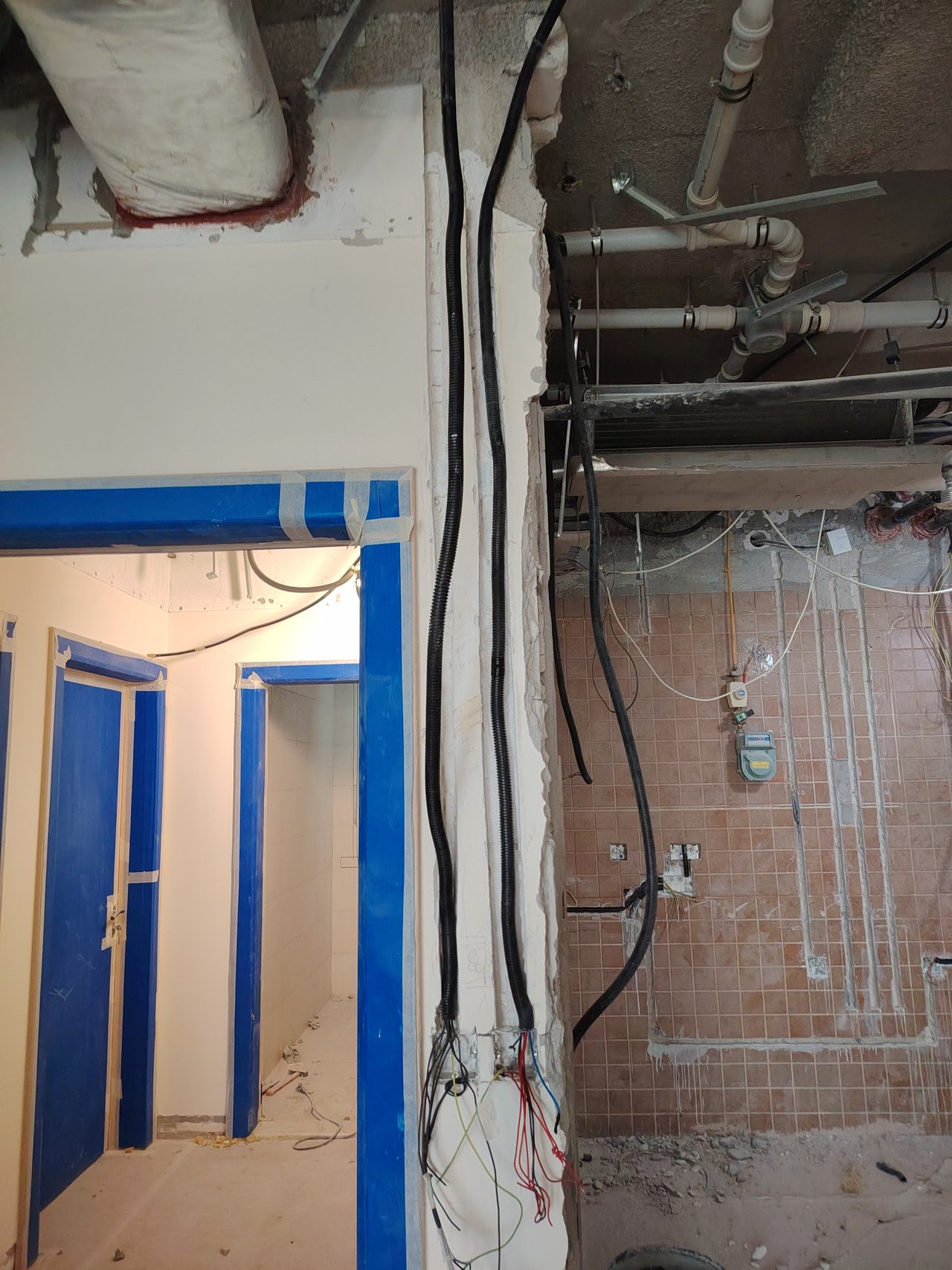 Demolition of old partitions and preparation for utility replacement in the dining area