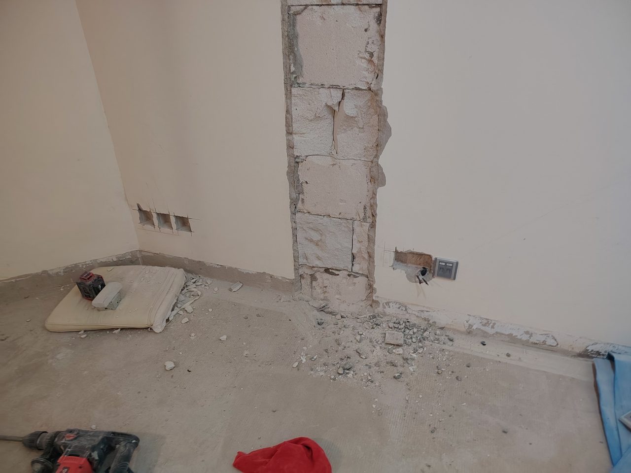Wall chasing for new electrical wiring and preparation for replacing old water supply pipes