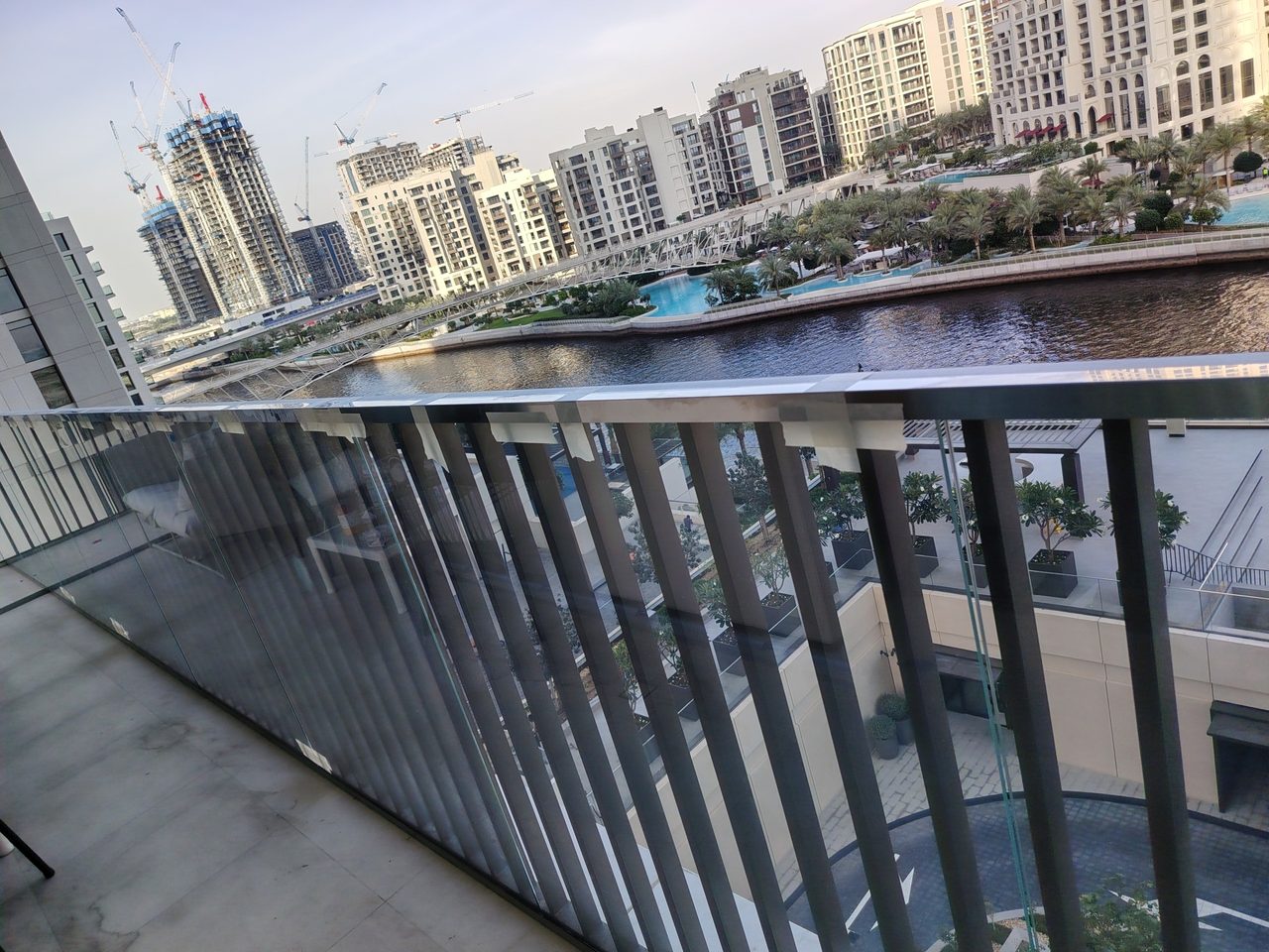 Secure fixation of triplex glass panels without visible fasteners